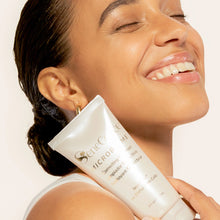 Load image into Gallery viewer, Model holding SeneGence Microbiome Correcting Cleanser product.
